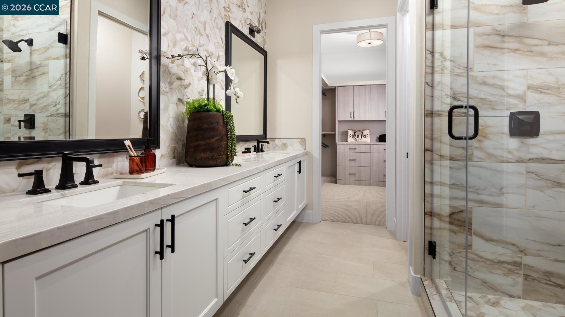 1885 Cascade Lane Tracy, CA 95377 - Photo 7 of 40 a bathroom with a granite countertop shower sink and mirror