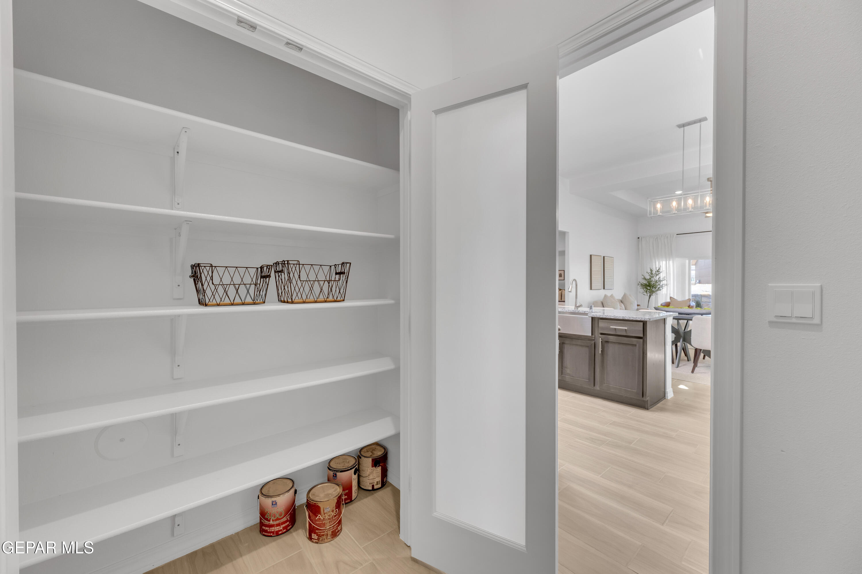 6022 Fall Ridge Sunland Park, NM 88008 - Photo 18 of 31 a view of kitchen utility room with racks and a sink