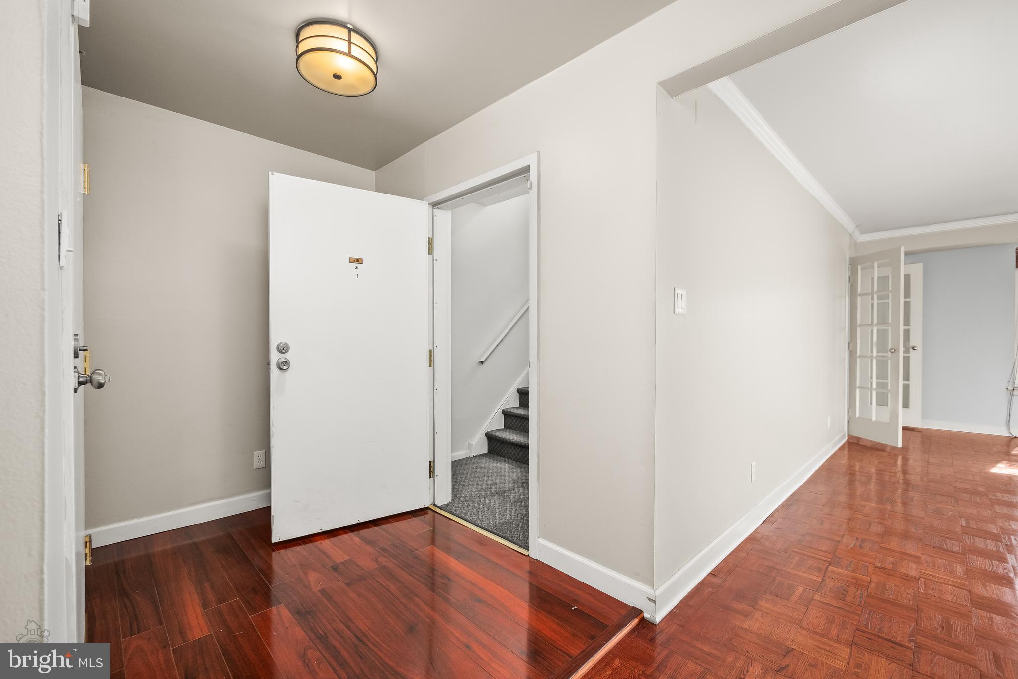 4000 Gypsy Lane, Unit 210 Philadelphia, PA 19129 - Photo 11 of 35 a view of a hallway with wooden floor