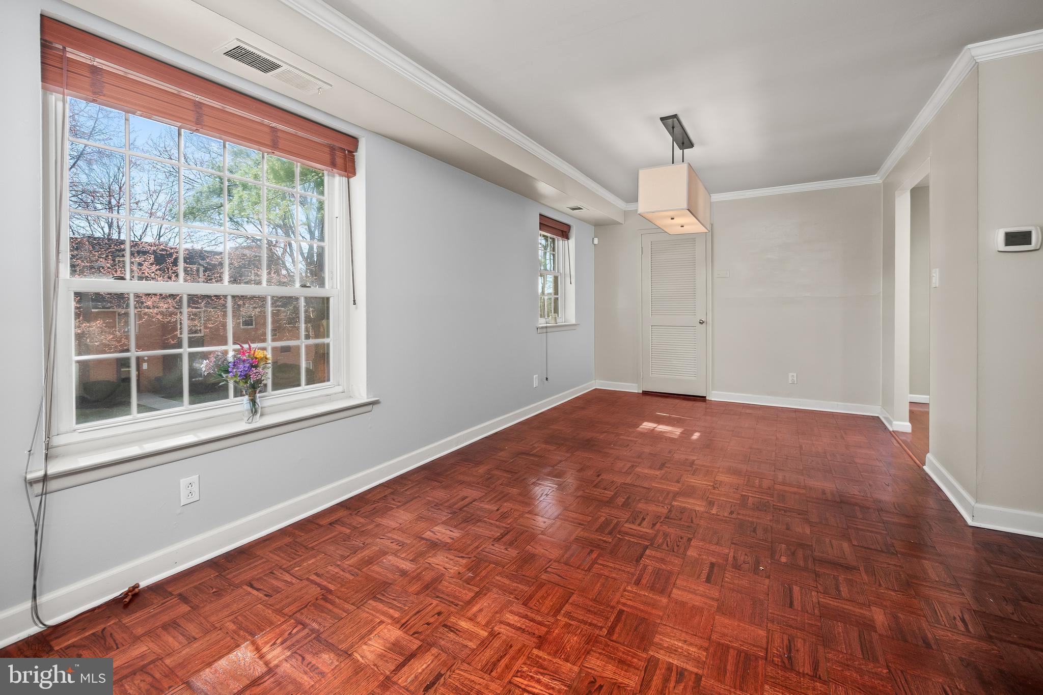 4000 Gypsy Lane, Unit 210 Philadelphia, PA 19129 - Photo 14 of 35 a view of empty room with wooden floor and fan