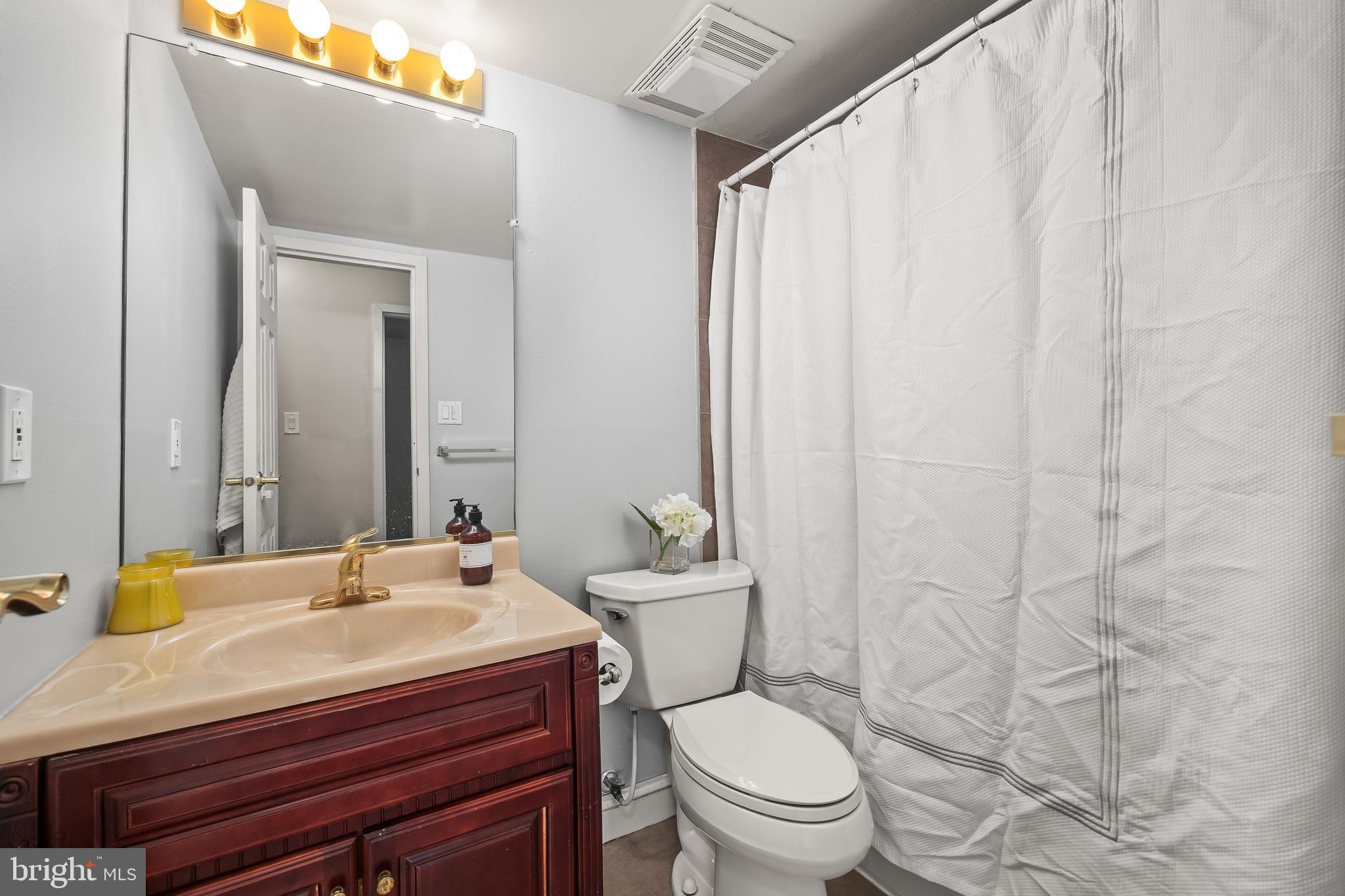 4000 Gypsy Lane, Unit 210 Philadelphia, PA 19129 - Photo 19 of 35 a bathroom with a sink toilet and shower