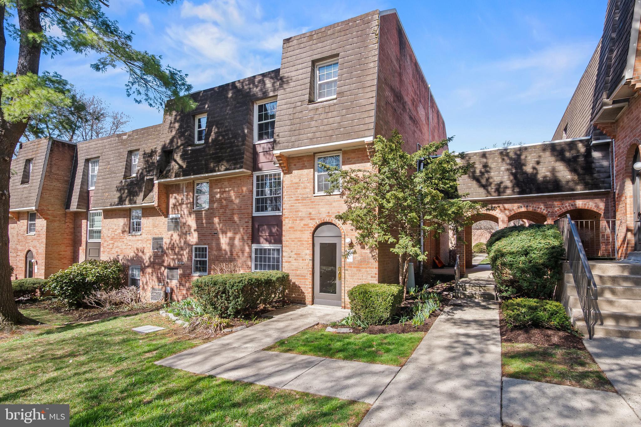 4000 Gypsy Lane, Unit 210 Philadelphia, PA 19129 - Photo 24 of 35 a front view of a house with garden