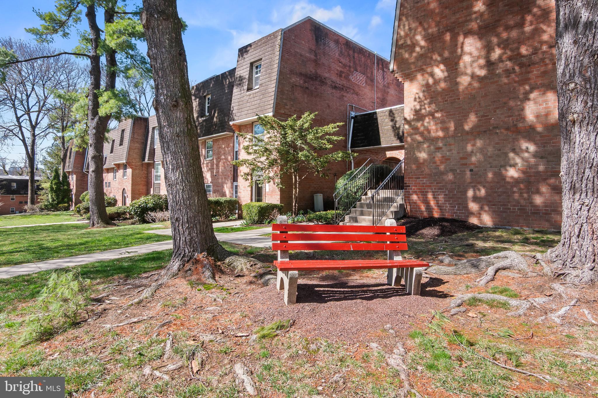 4000 Gypsy Lane, Unit 210 Philadelphia, PA 19129 - Photo 27 of 35 a backyard of a house with barbeque oven table and chairs