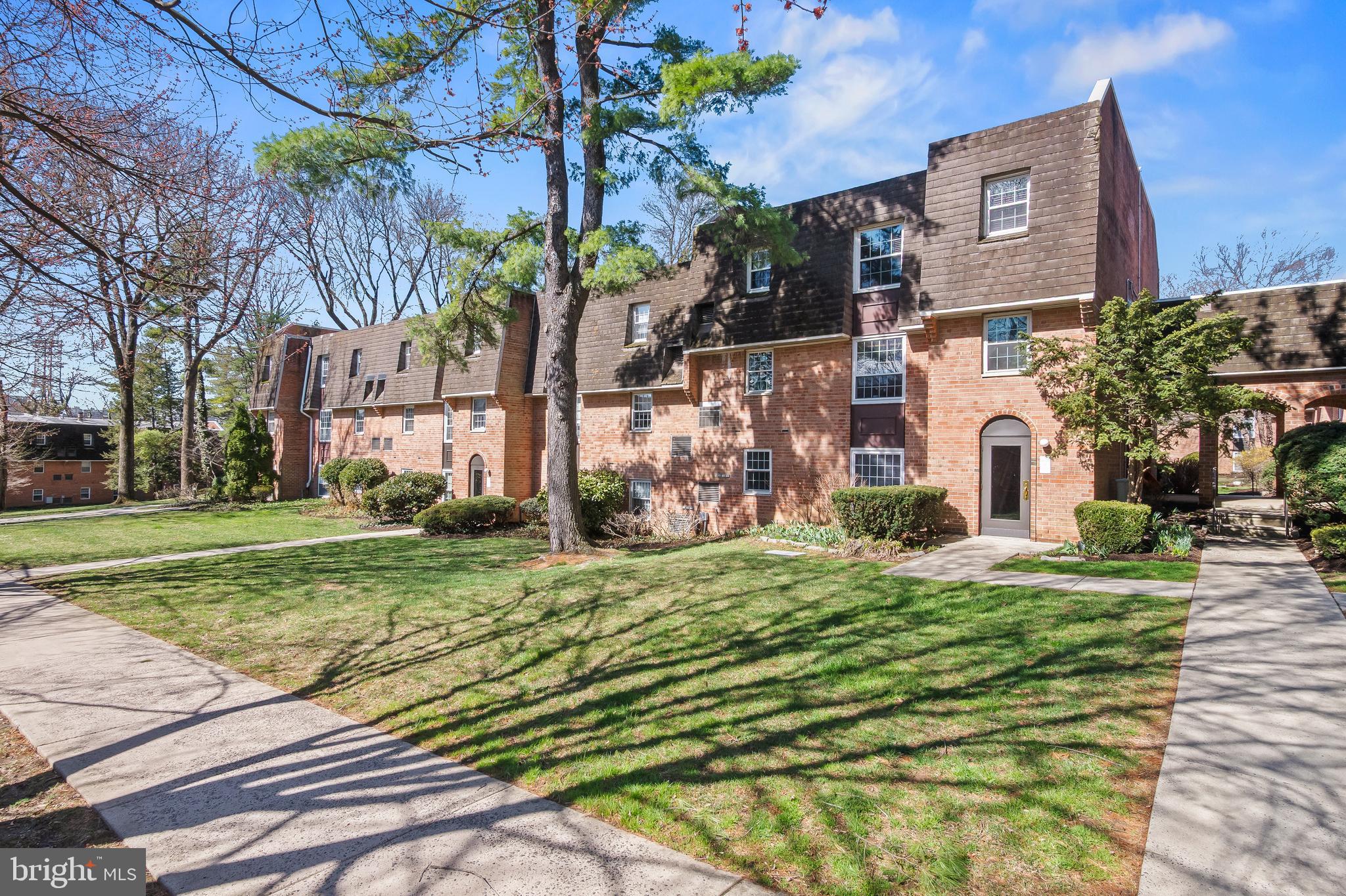 4000 Gypsy Lane, Unit 210 Philadelphia, PA 19129 - Photo 28 of 35 a front view of a house with a yard