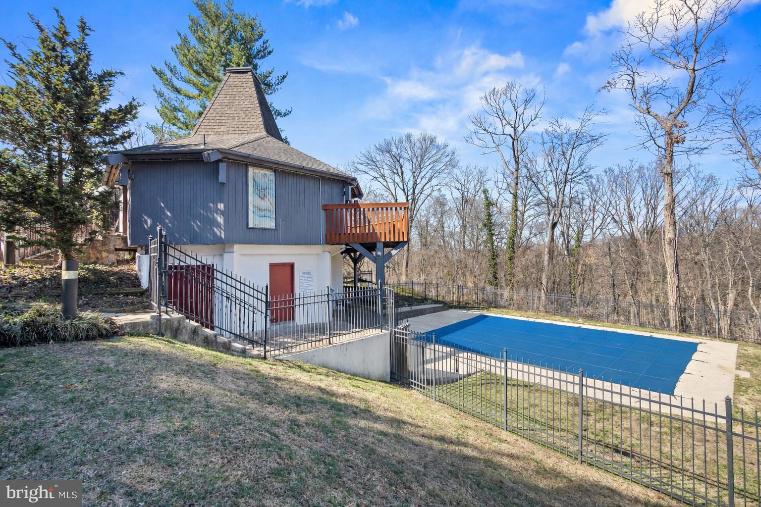 4000 Gypsy Lane, Unit 210 Philadelphia, PA 19129 - Photo 34 of 35 a view of a house with a wooden fence and a tree