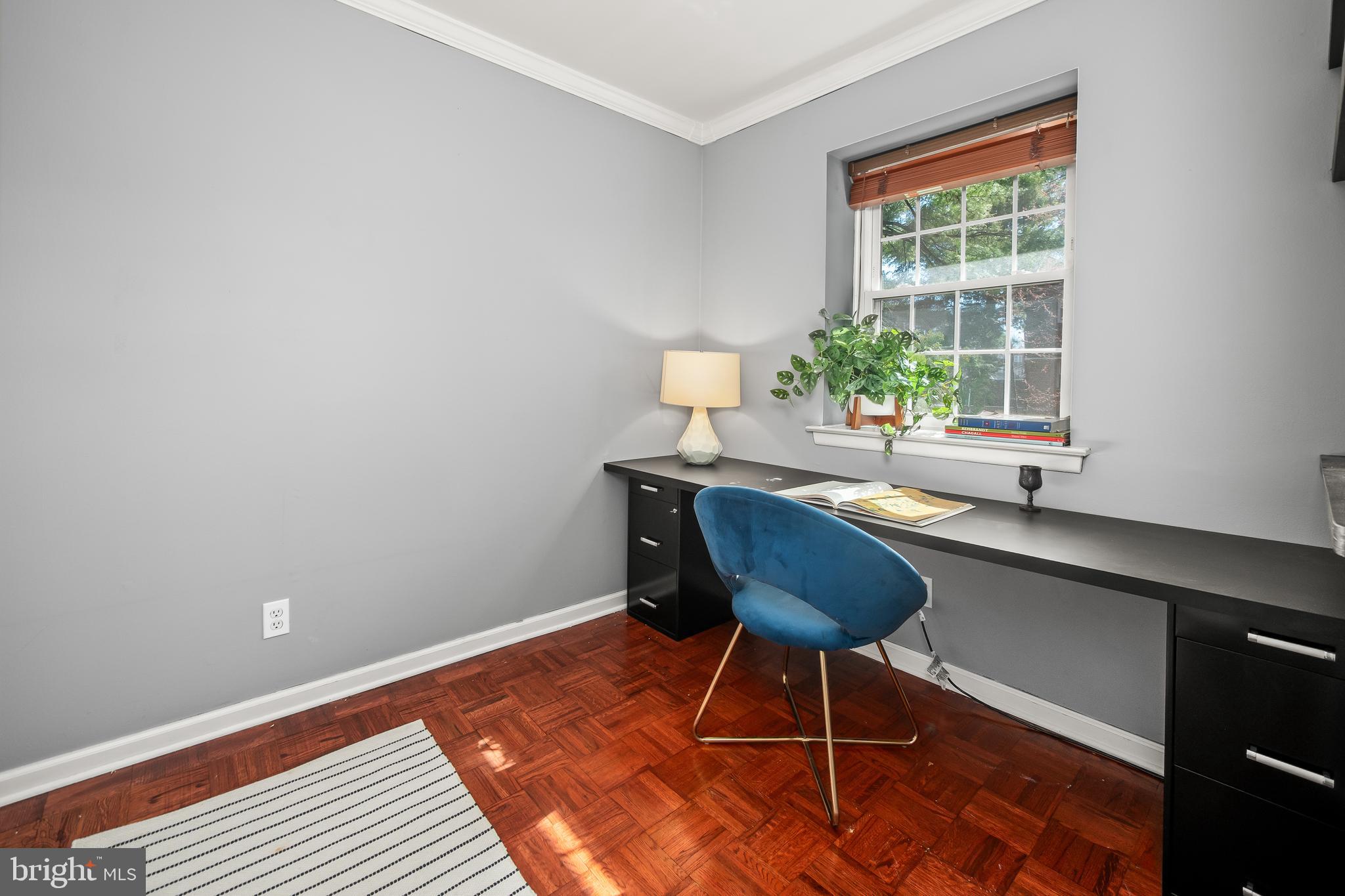 4000 Gypsy Lane, Unit 210 Philadelphia, PA 19129 - Photo 6 of 35 a room with a table and a potted plant