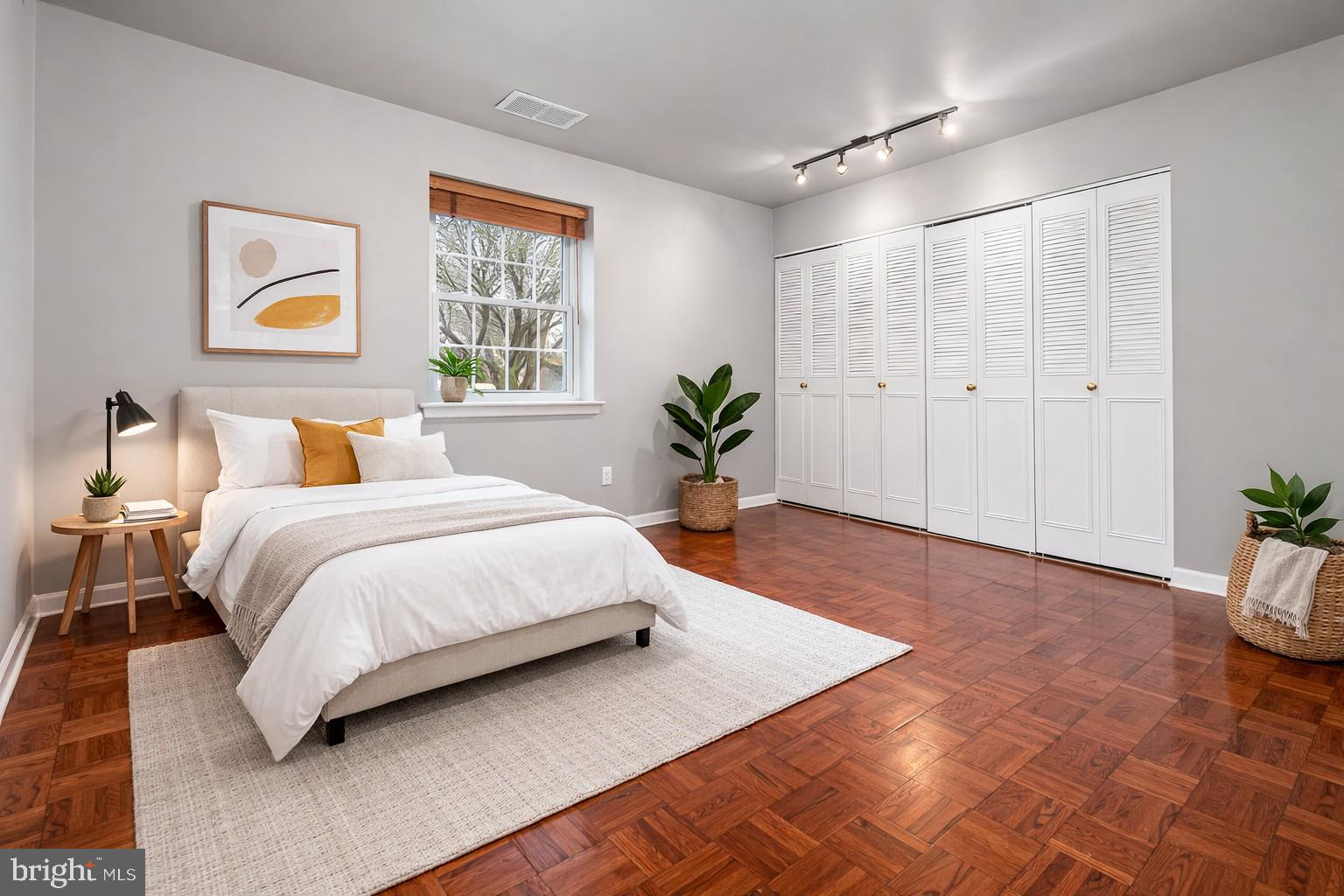 4000 Gypsy Lane, Unit 210 Philadelphia, PA 19129 - Photo 8 of 35 a bed room with a bed and a painting on the wall