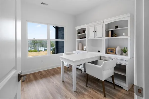 a bedroom with a bed and a table in it