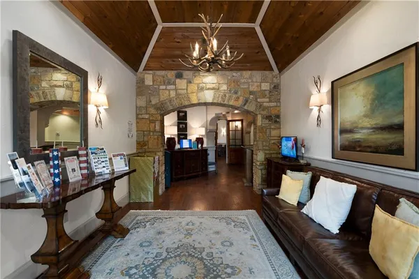 a kitchen with a sink and chairs