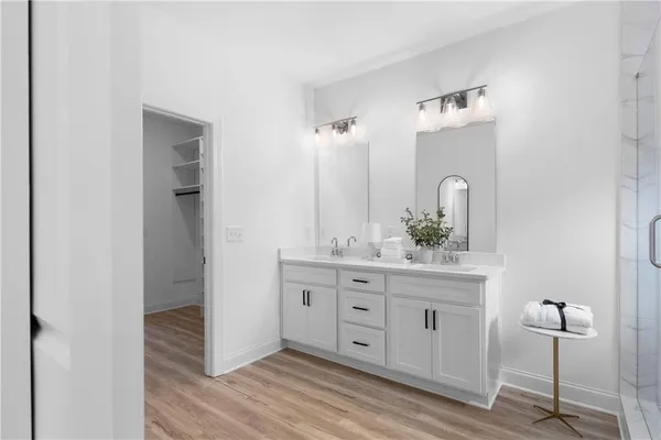 a bathroom with a shower and a sink