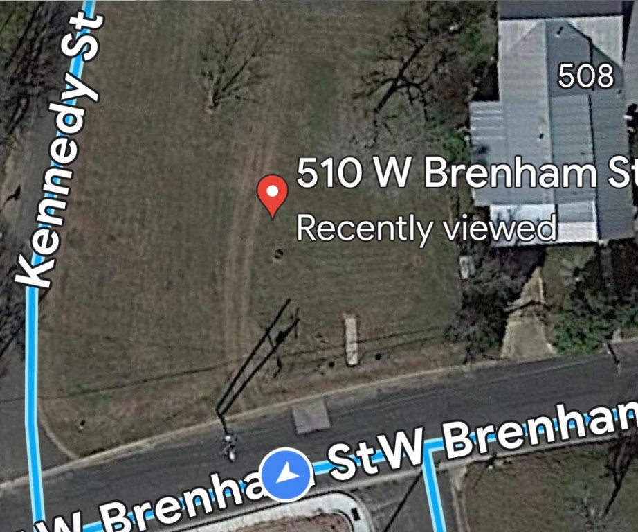 510 West Brenham Street Elgin, TX 78621 - Photo 2 of 17 a close up of a sign