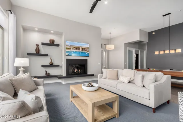 a bedroom with a bed and mirror