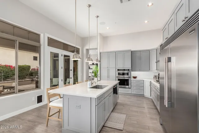 a bathroom with a sink a toilet and shower curtain