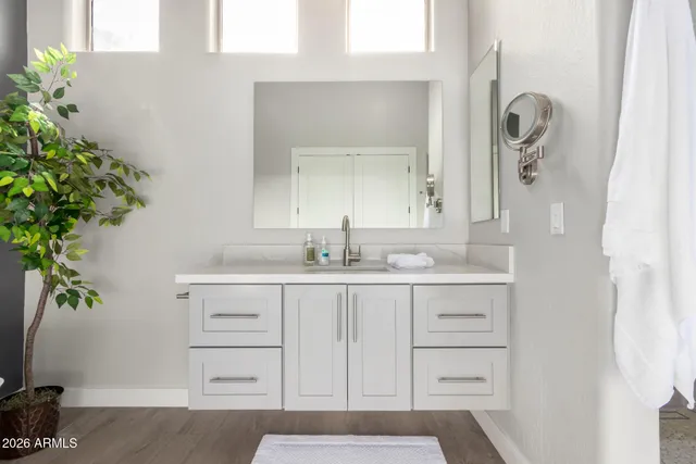 a view of swimming pool with outdoor seating and plants