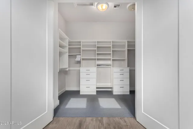 a living room with furniture a flat screen tv and a large window