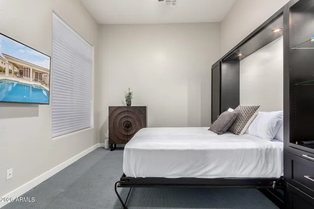 a room with wooden floor table and chairs