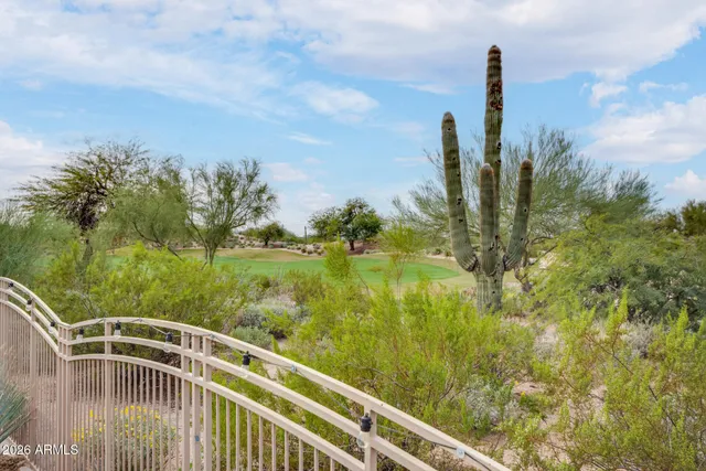 a room with pool table and windows