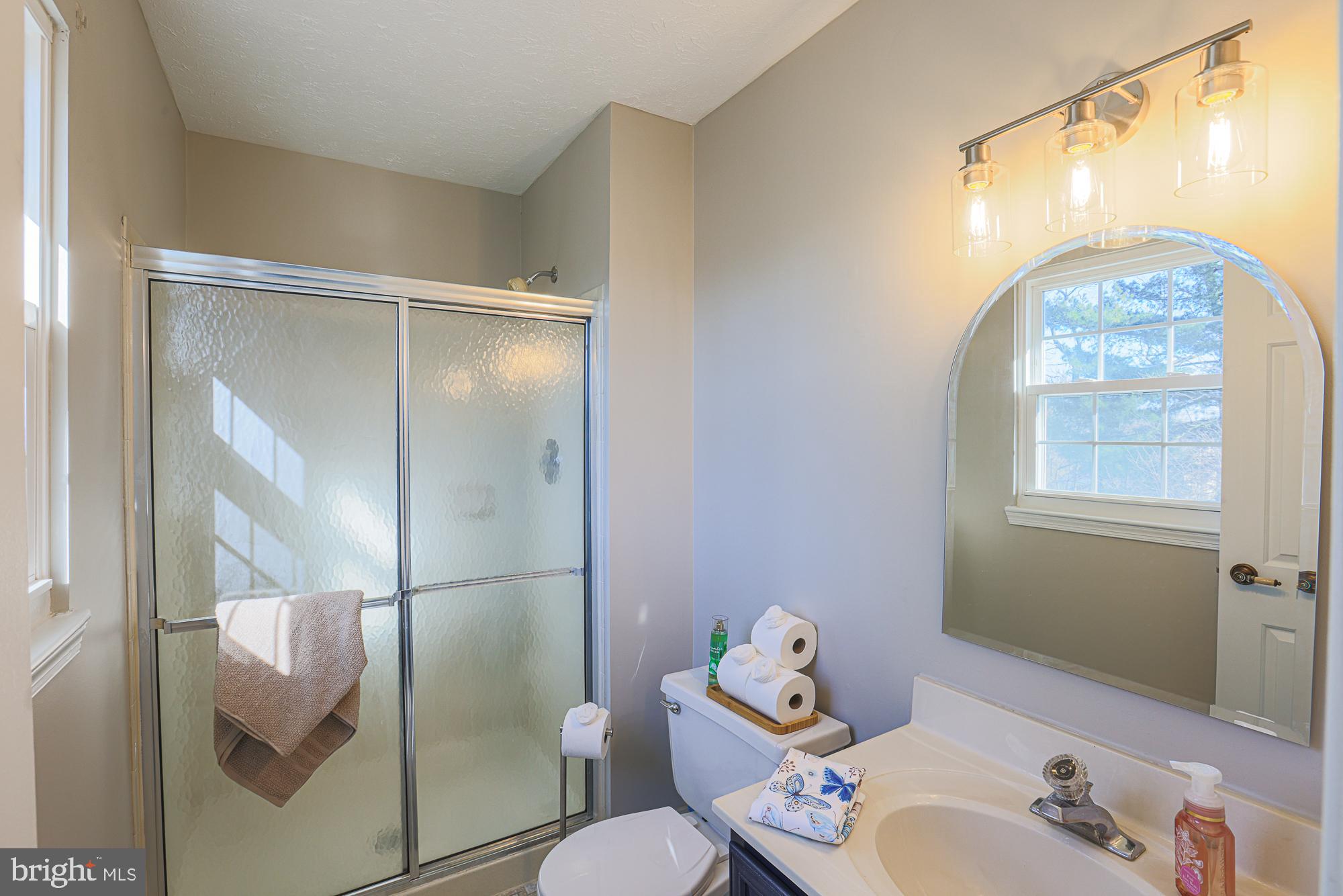 3607 Parkhurst Way Baltimore, MD 21236 - Photo 34 of 63 a bathroom with a sink mirror and toilet