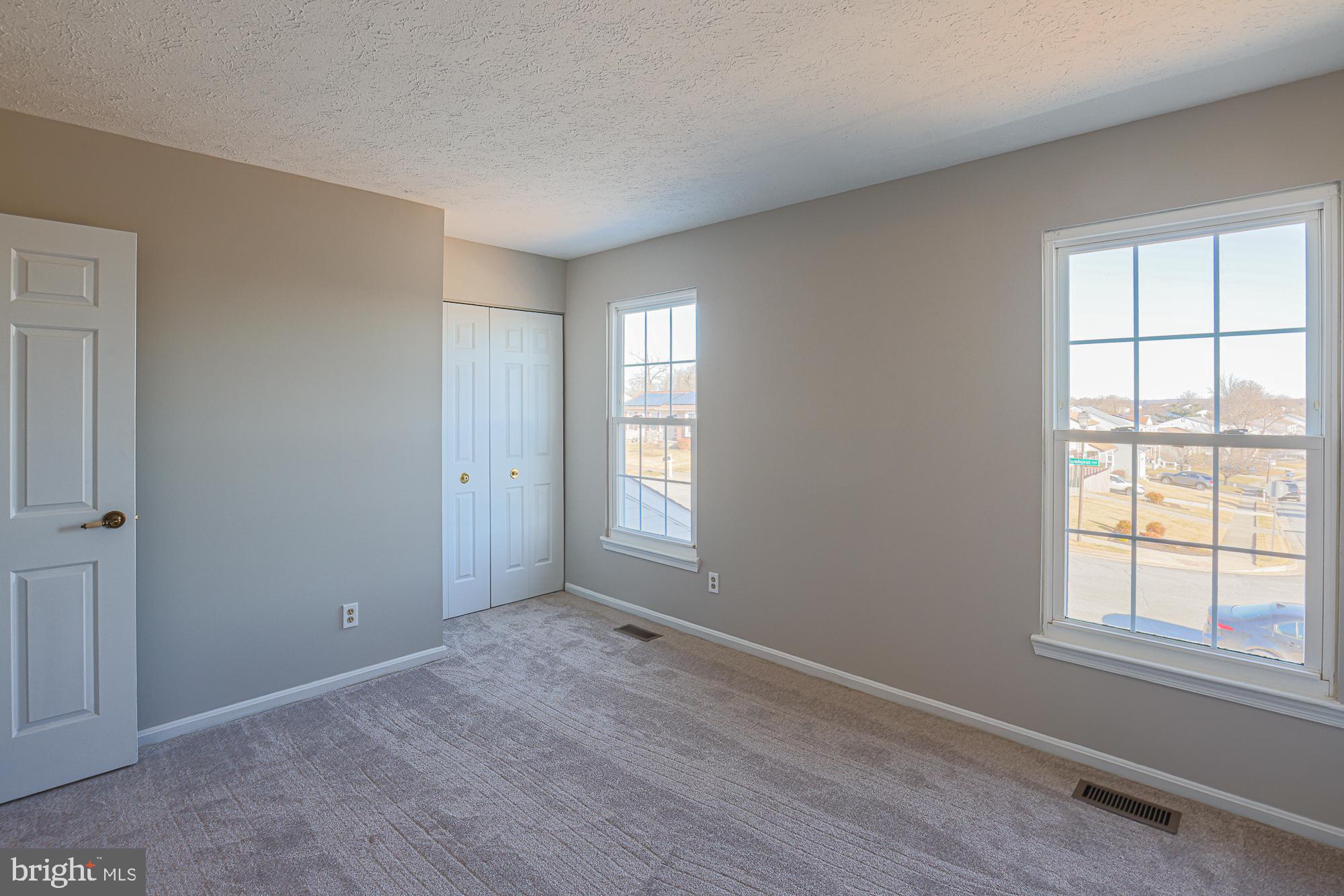 3607 Parkhurst Way Baltimore, MD 21236 - Photo 38 of 63 an empty room with windows