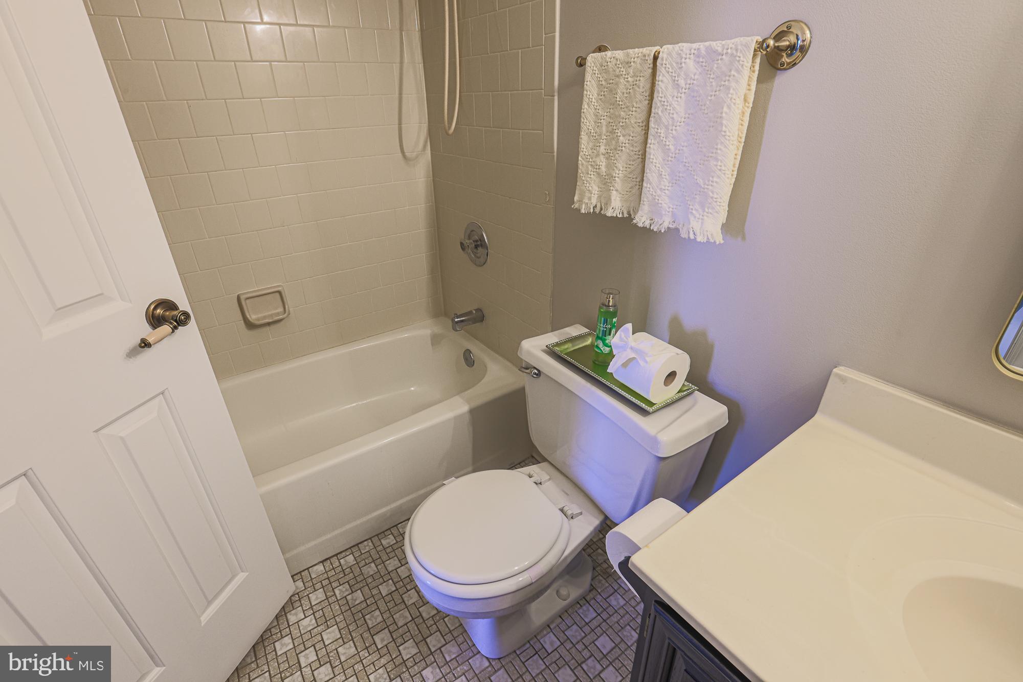 3607 Parkhurst Way Baltimore, MD 21236 - Photo 44 of 63 a white toilet sitting next to a bath tub