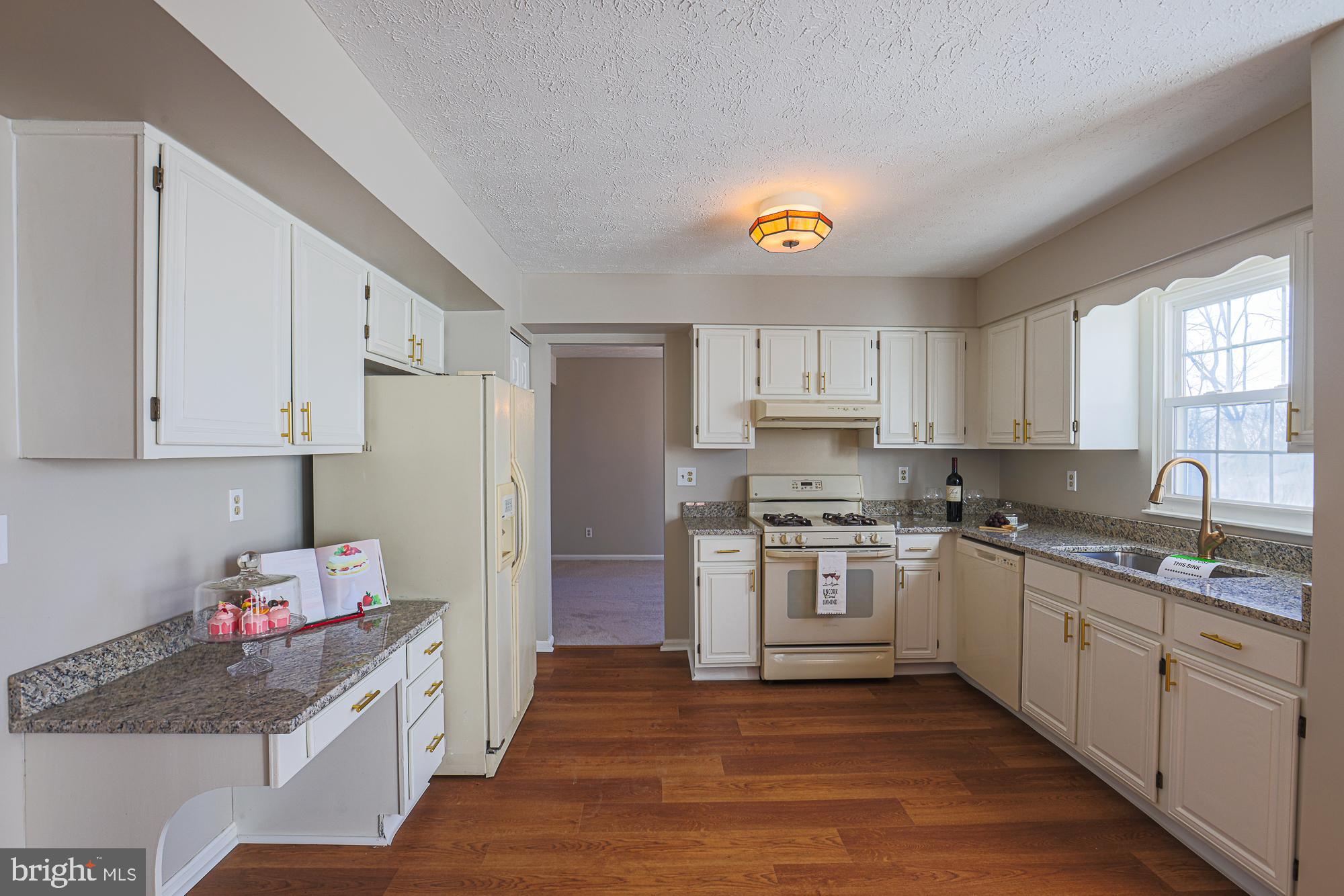 3607 Parkhurst Way Baltimore, MD 21236 - Photo 8 of 63 a kitchen with stainless steel appliances granite countertop a sink stove and refrigerator