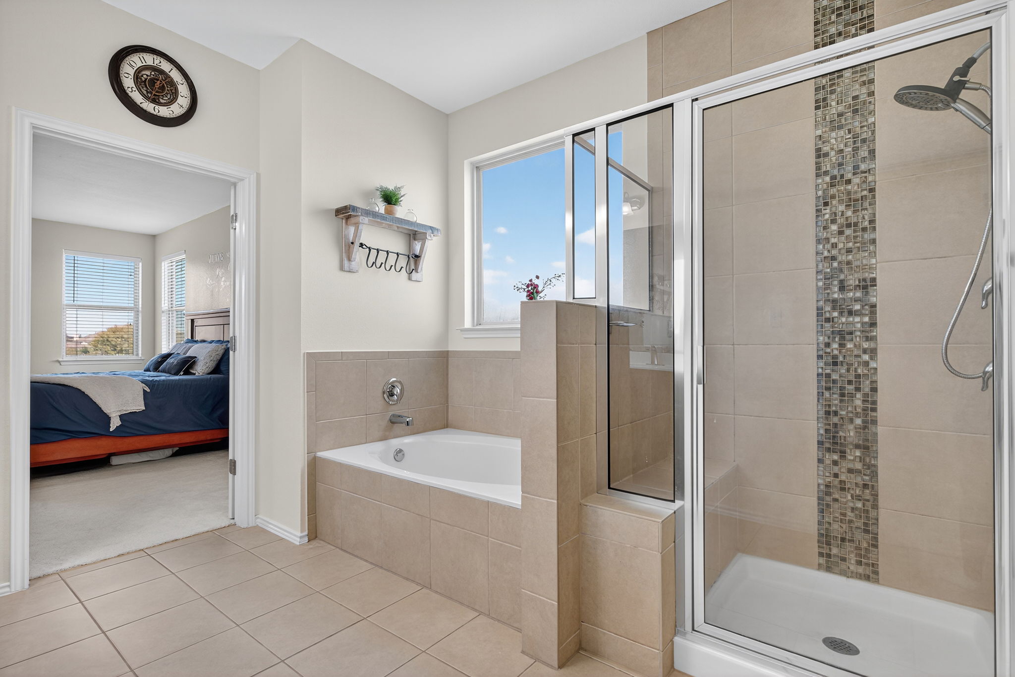 13300 Craven Lane Manor, TX 78653 - Photo 18 of 40 Primary bathroom with a soaking tub, and a walk-in shower