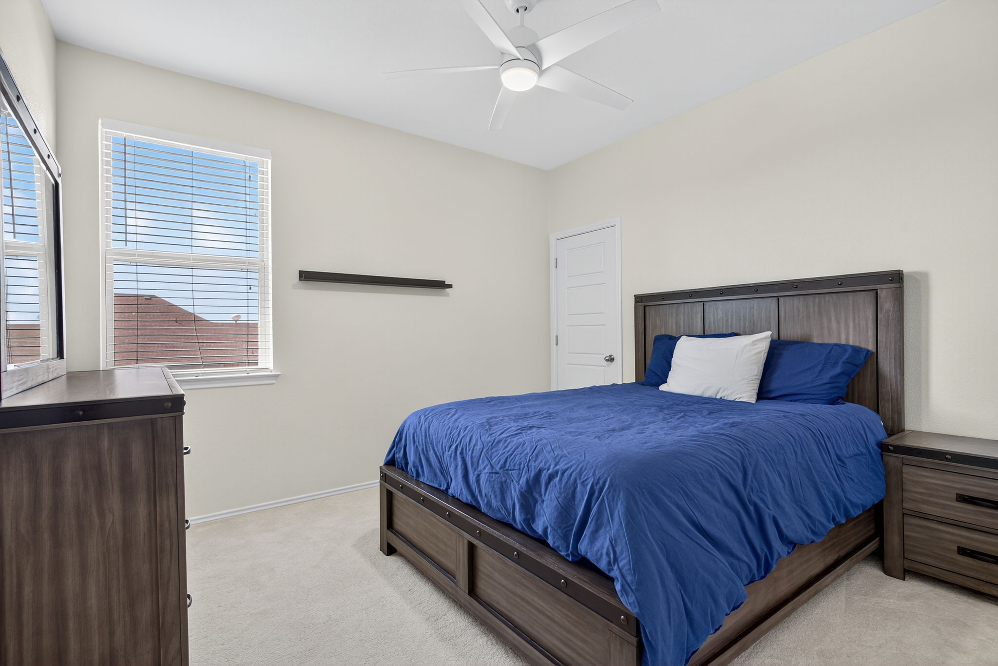 13300 Craven Lane Manor, TX 78653 - Photo 19 of 40 Spacious Secondary Bedroom featuring high-end carpet and ceiling fan with a walk-in closet
