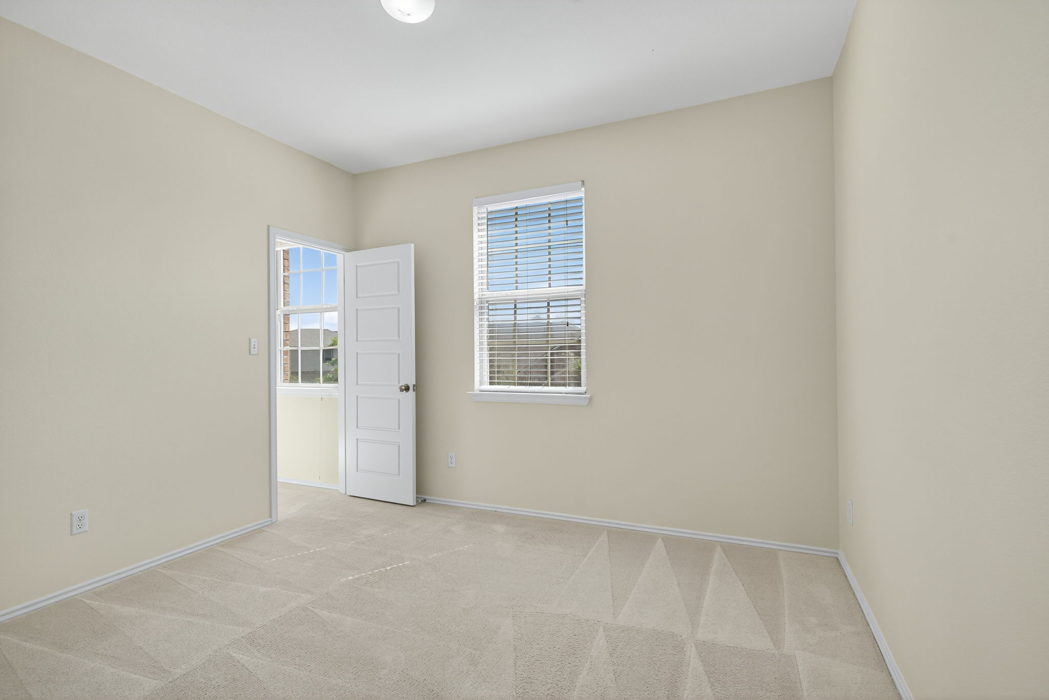 13300 Craven Lane Manor, TX 78653 - Photo 23 of 40 Secondary Bedroom with walk-in closet with a window.