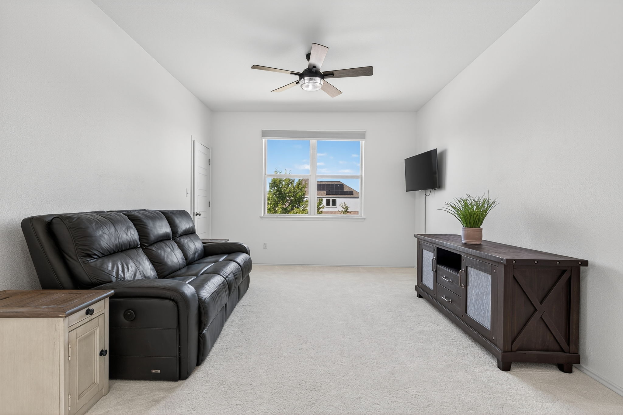 13300 Craven Lane Manor, TX 78653 - Photo 24 of 40 Media Room/Flex Space featuring light carpet and a ceiling fan