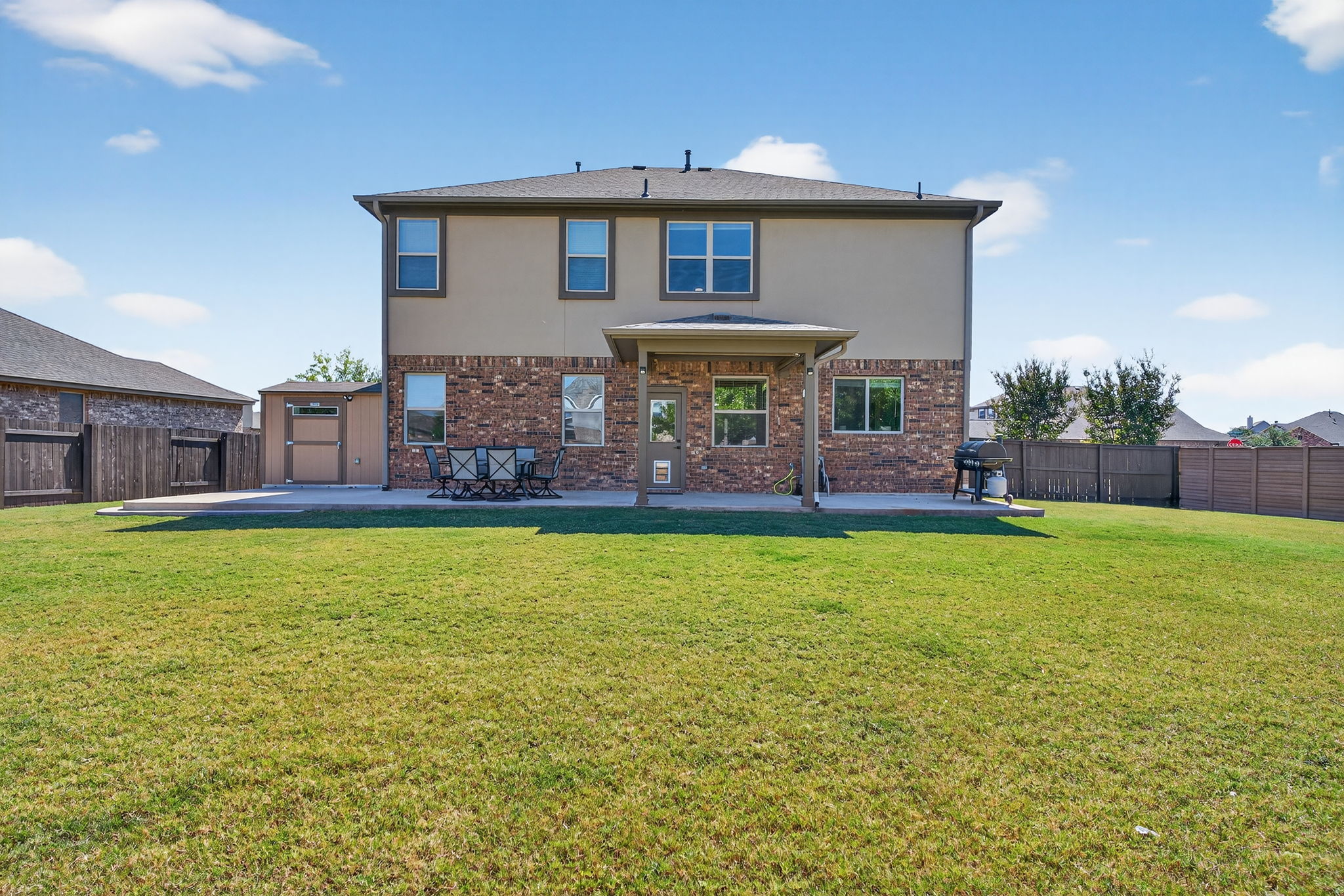 13300 Craven Lane Manor, TX 78653 - Photo 28 of 40 Back of house featuring a 50-foot patio!
