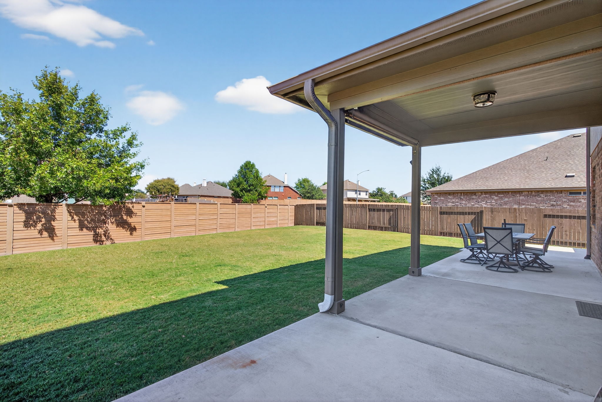 13300 Craven Lane Manor, TX 78653 - Photo 30 of 40 Fenced backyard with a patio area