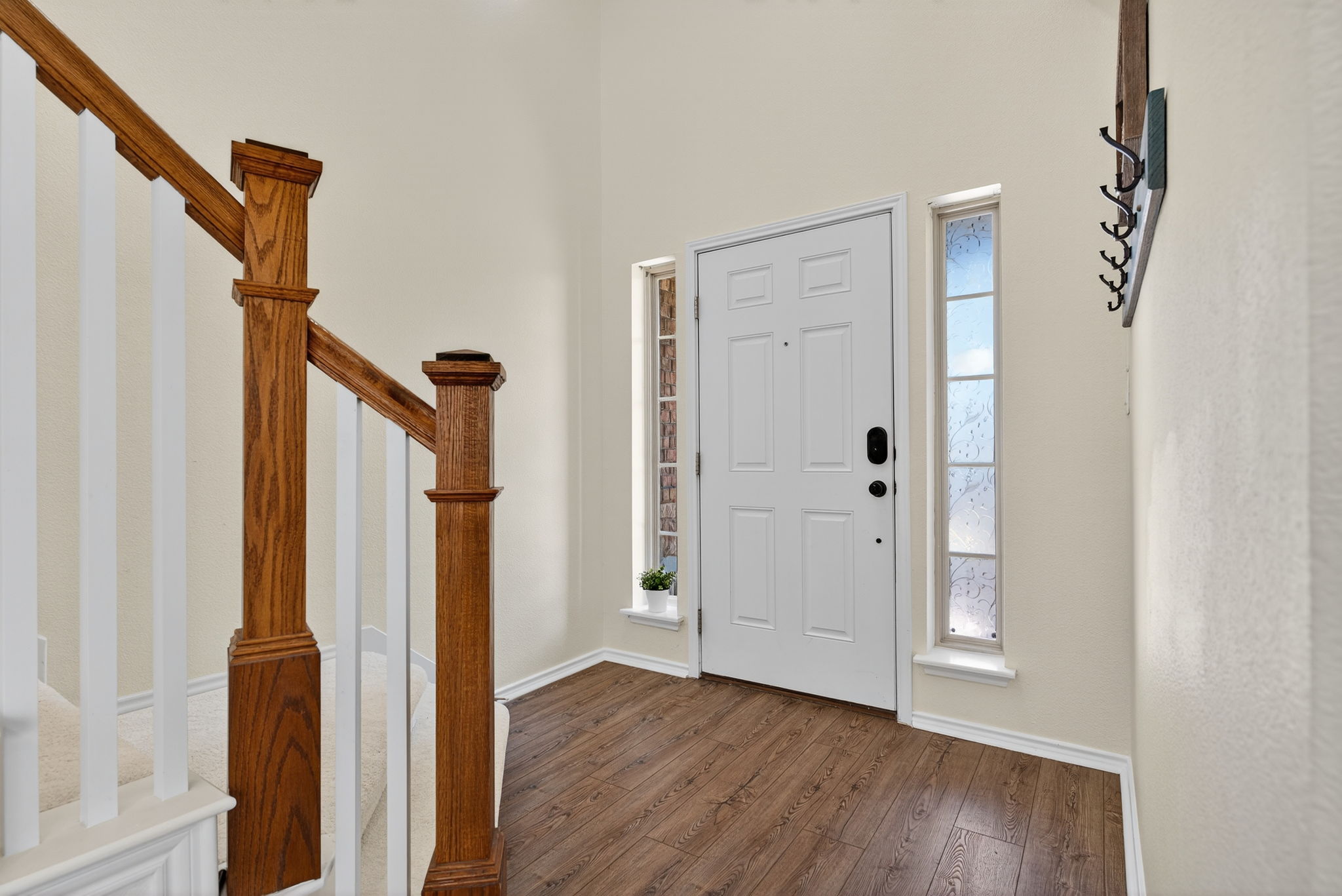 13300 Craven Lane Manor, TX 78653 - Photo 8 of 40 Foyer showing the staircase to the 2nd floor and coat rack.