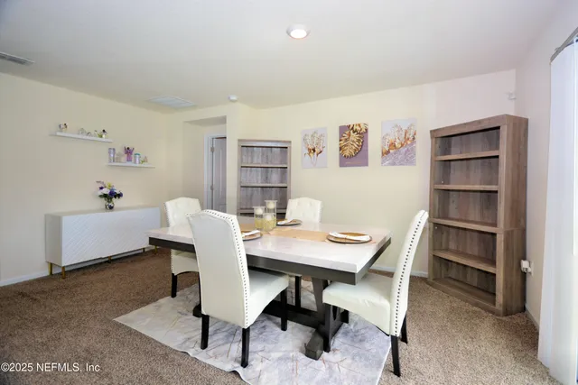 a view of a workspace with furniture