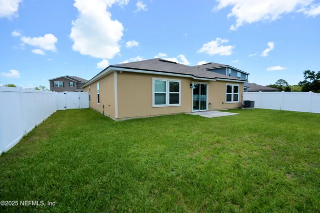 a view of a yard in front of a house with a yard