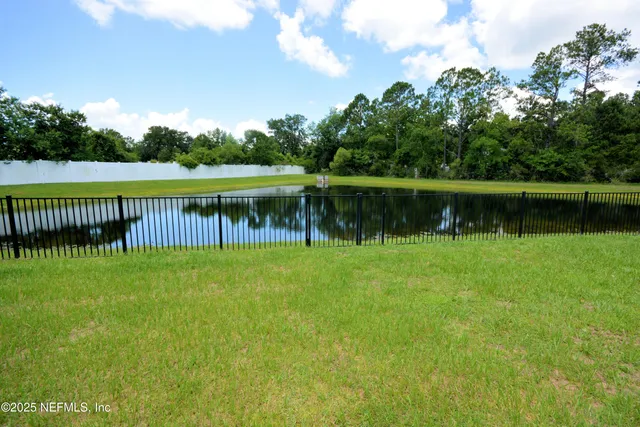 a view of lake with green space