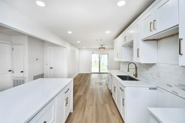 a spacious bathroom with a sink and a shower