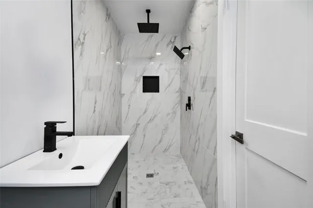 a bathroom with a sink and a mirror
