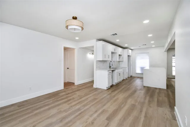 a view of kitchen with wooden floor