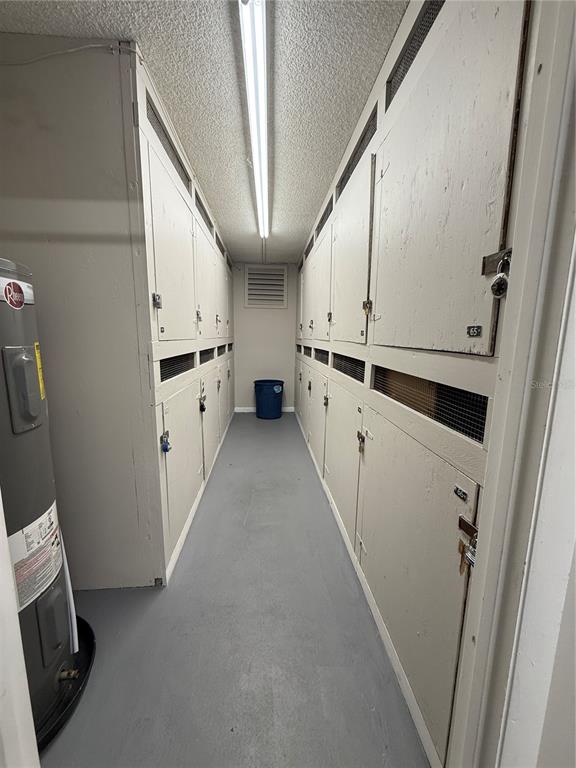 2500 Lee Road, Unit 122 Winter Park, FL 32789 - Photo 24 of 25 a kitchen with granite countertop white cabinets and white appliances
