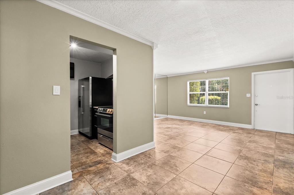 2500 Lee Road, Unit 122 Winter Park, FL 32789 - Photo 7 of 25 an empty room with windows and closet