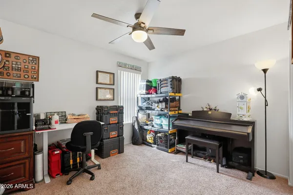 a view of a workspace with furniture and toys