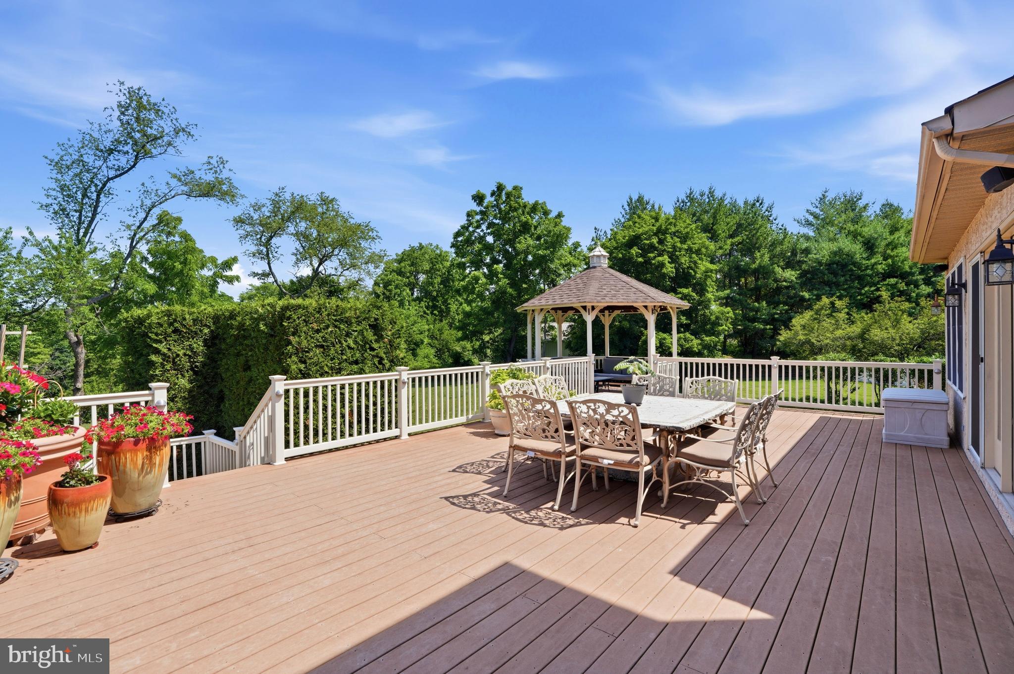 2303 Redtail Road Norristown, PA 19403 - Photo 35 of 53 a roof deck with table and chairs a barbeque with wooden floor and fence