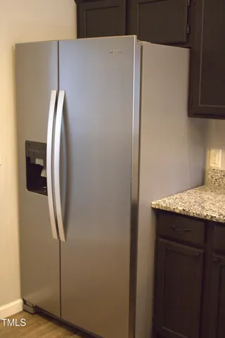 a view of a kitchen with wooden floor