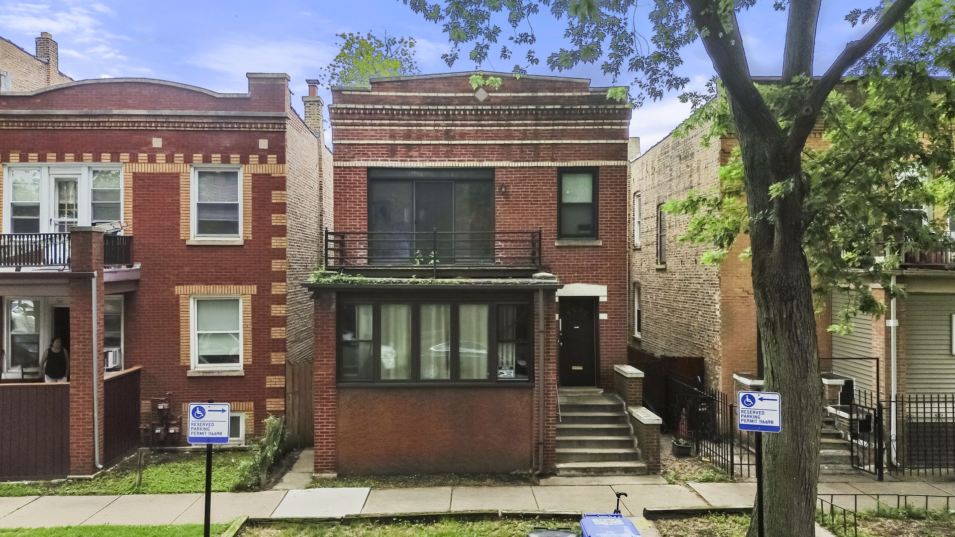 a front view of a house with stairs