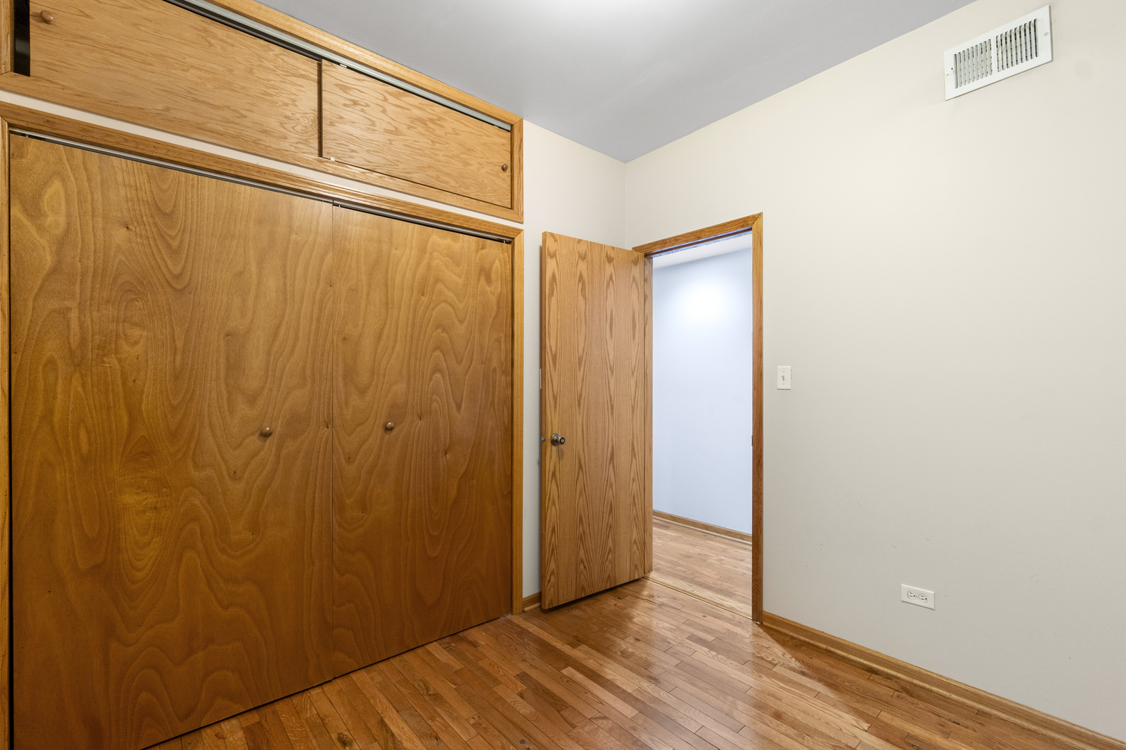 7223 North Damen Avenue Chicago, IL 60645 - Photo 11 of 37 a view of a room with wooden floor