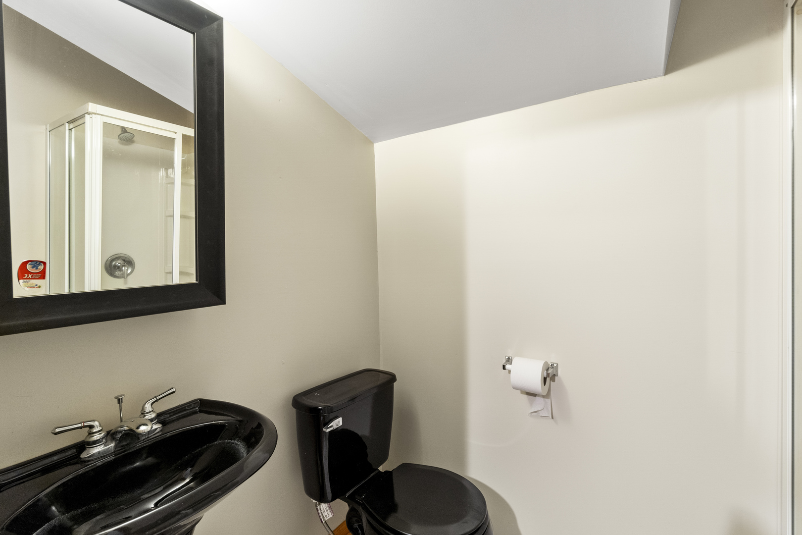 7223 North Damen Avenue Chicago, IL 60645 - Photo 15 of 37 a bathroom with a sink and a mirror