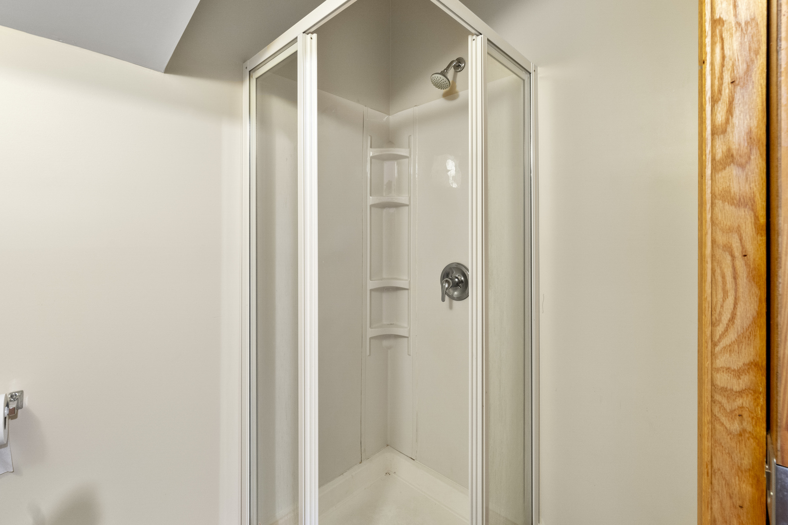 7223 North Damen Avenue Chicago, IL 60645 - Photo 16 of 37 a bathroom with a glass shower door