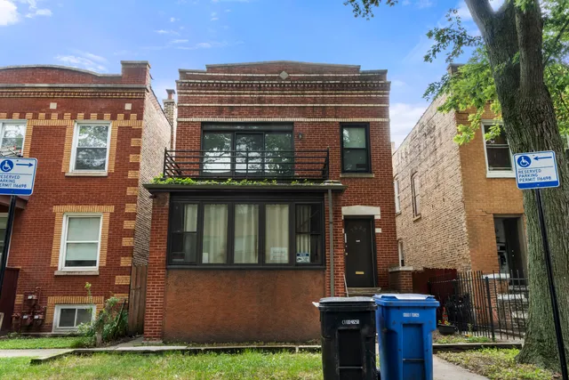 front view of a building with a garden