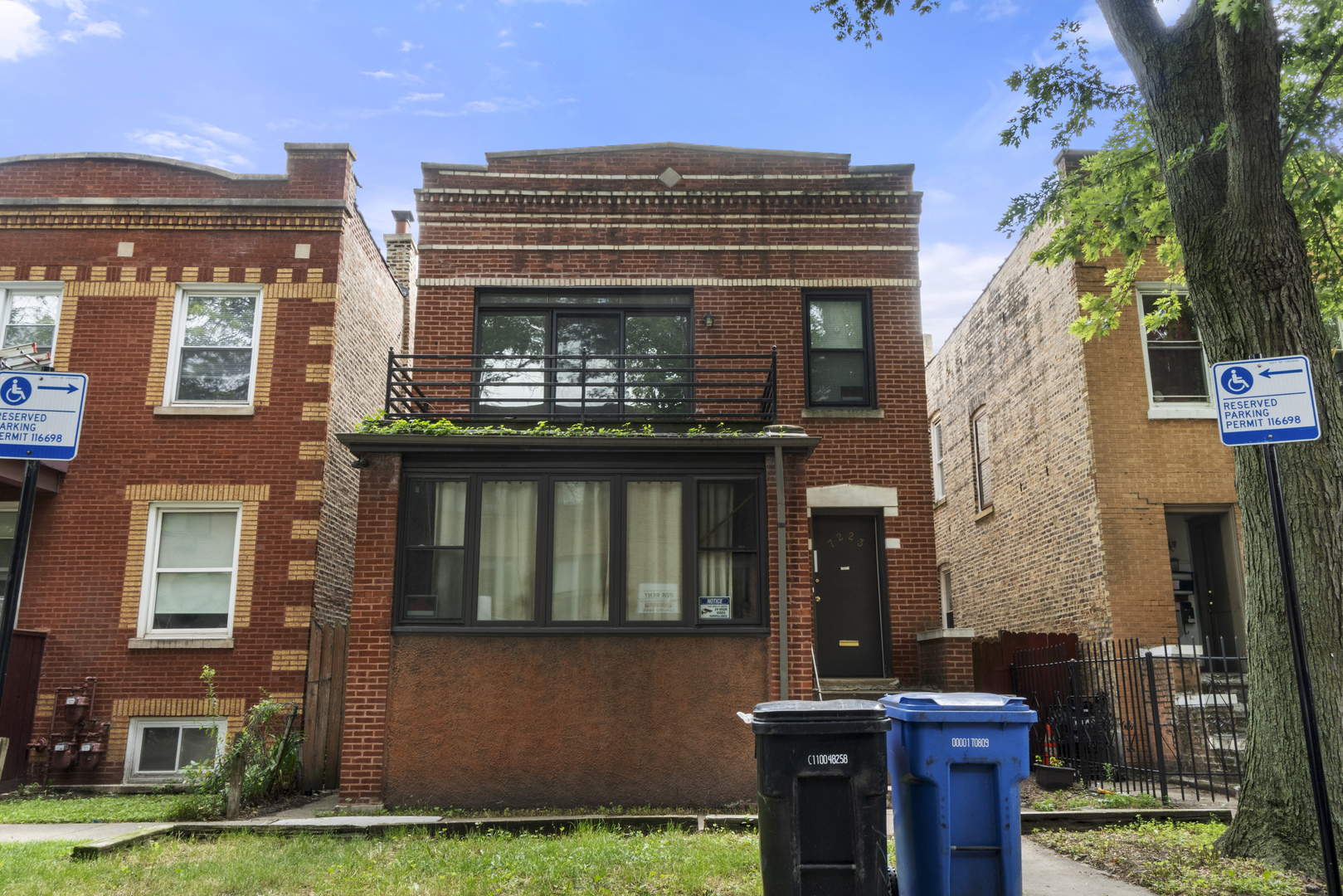 7223 North Damen Avenue Chicago, IL 60645 - Photo 2 of 37 front view of a building with a garden