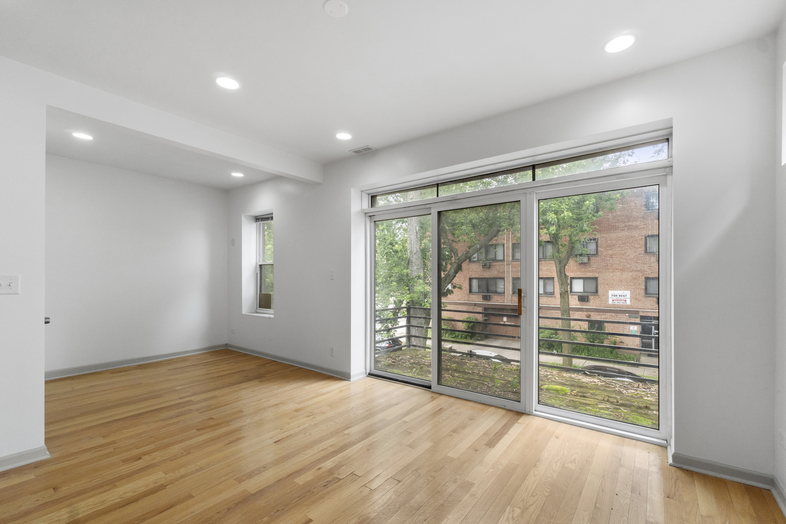7223 North Damen Avenue Chicago, IL 60645 - Photo 23 of 37 wooden floor in an empty room with a window